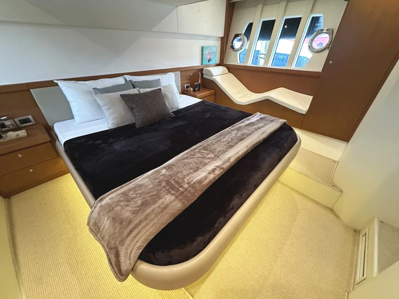Slide: The Image of Luxurious bedroom interior of 2014 Ferretti Yachts 530 with modern design and cozy bedding. - 29