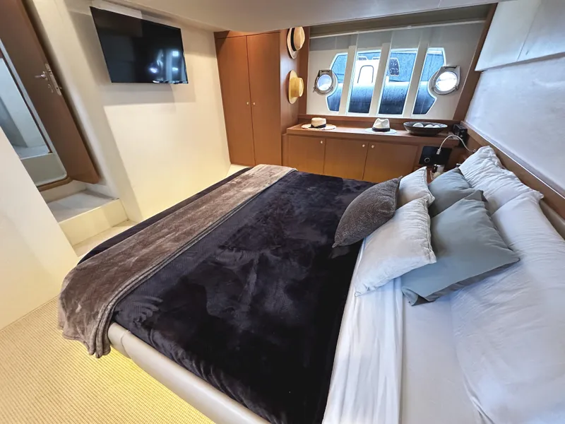 Slide: The Image of Luxurious bedroom in 2014 Ferretti Yachts 530 with modern decor and cozy bedding. - 30