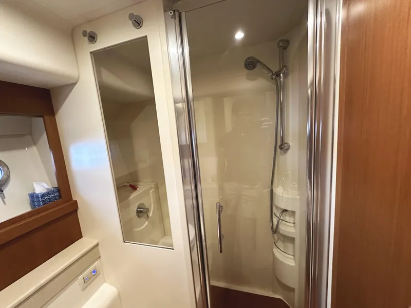 Slide: The Image of Luxurious bathroom in 2014 Ferretti Yachts 530 with modern shower and sleek design. - 33