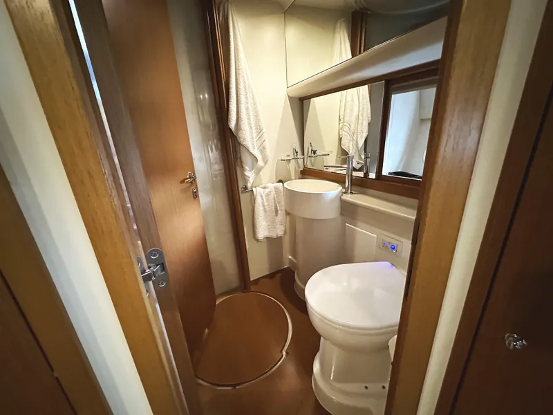 Slide: The Image of Luxurious bathroom in 2014 Ferretti Yachts 530, featuring modern fixtures and elegant wood finishes. - 38