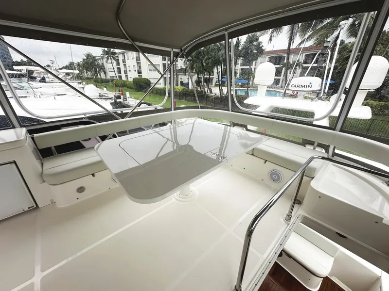 Slide: The Image of Ferretti Yachts 530, 2014 model, featuring a spacious outdoor seating area. - 43