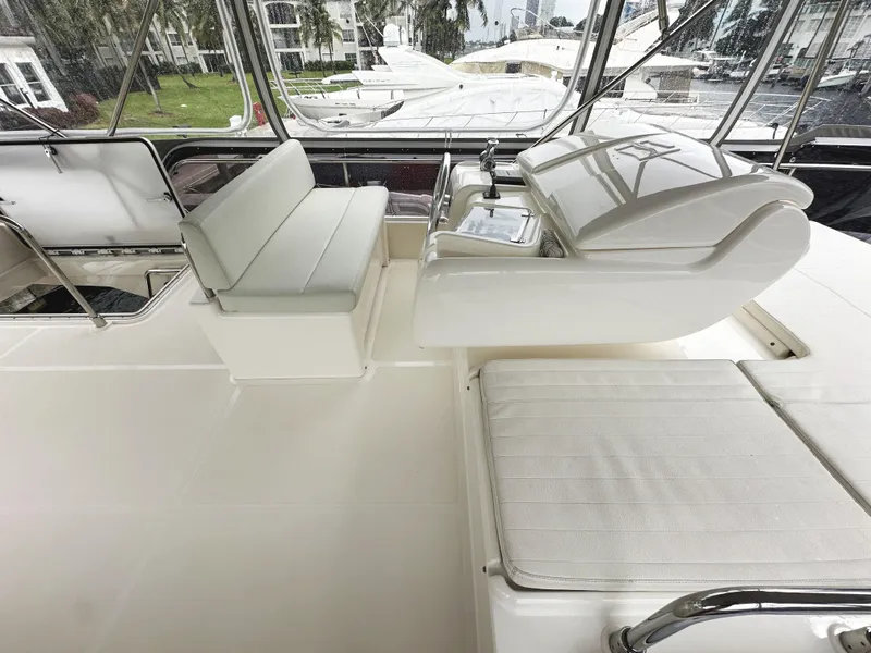 Slide: The Image of Ferretti Yachts 530, 2014 model, luxurious white interior with seating and helm station. - 48