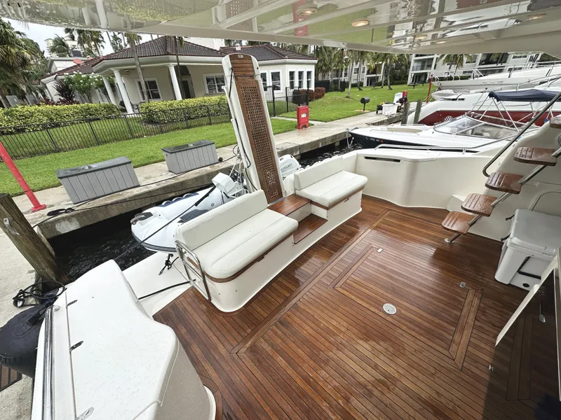 Slide: The Image of 2014 Ferretti Yachts 530 with elegant teak deck and comfortable seating at marina. - 5
