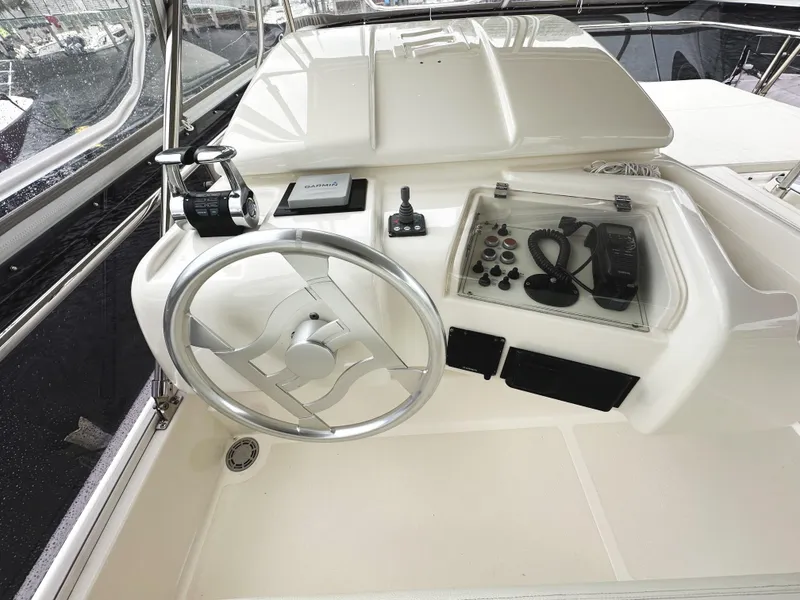 Slide: The Image of Steering console of 2014 Ferretti Yachts 530, featuring modern controls and navigation equipment. - 51