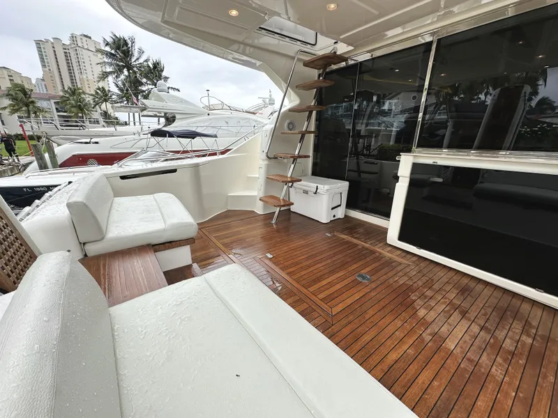 Slide: The Image of Luxurious 2014 Ferretti Yachts 530 with elegant teak deck and modern seating area. - 8