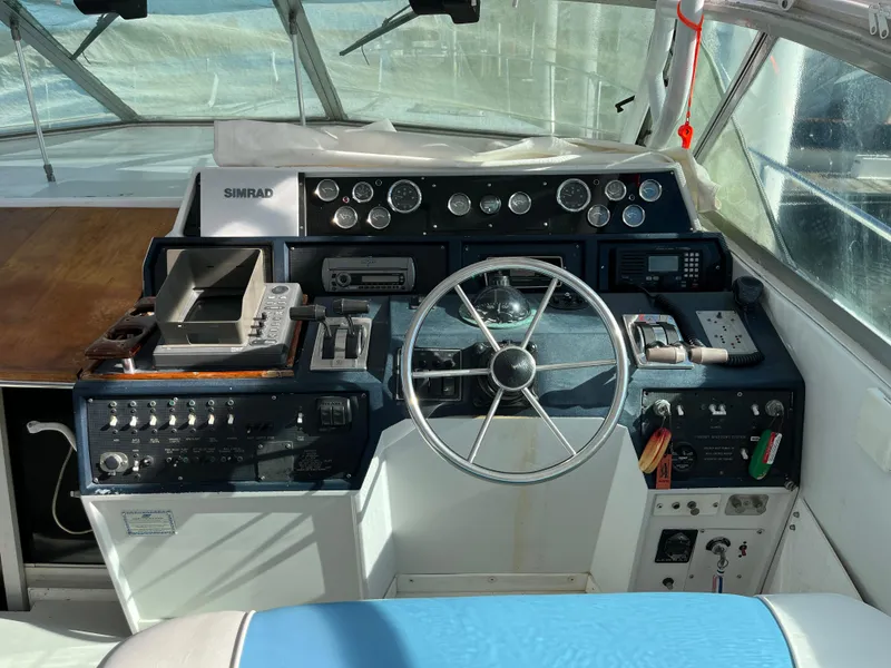 Slide: The Image of Cockpit of 1987 Sea Ray 460 boat with steering wheel and control panel. - 19