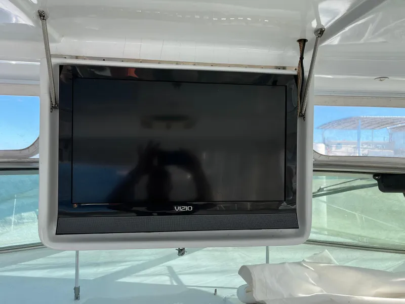 Slide: The Image of Vizio TV mounted inside a 1987 Sea Ray 460 boat cabin. - 21