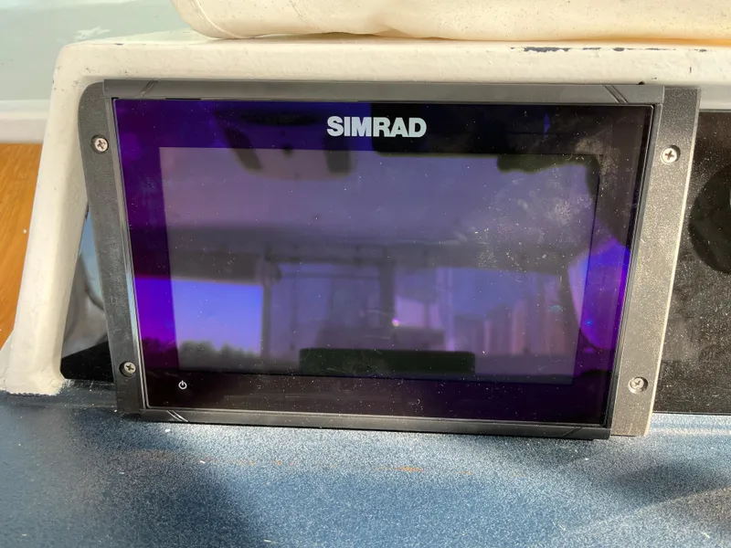 Slide: The Image of Simrad marine display on 1987 Sea Ray 460 boat dashboard. - 25