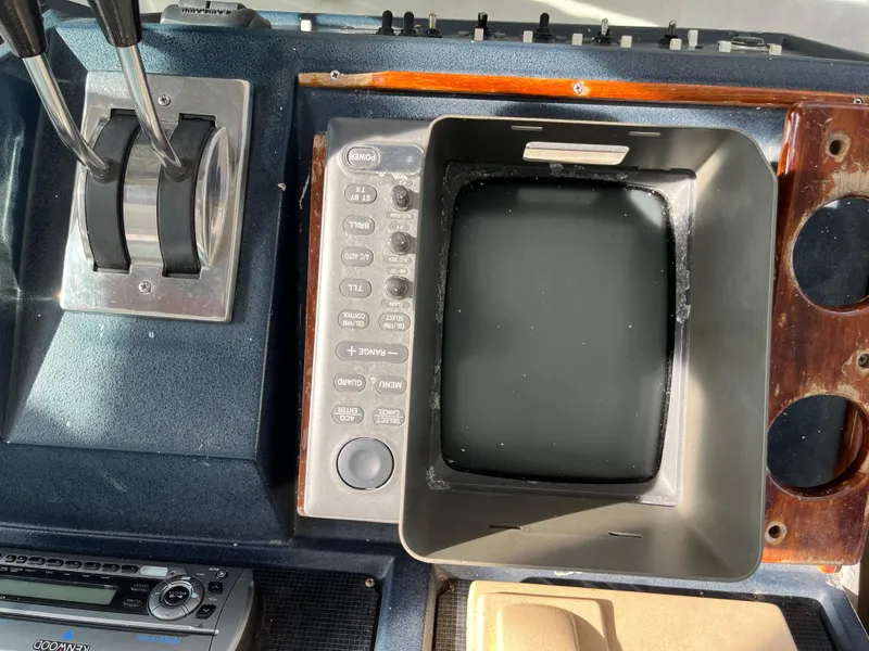 Slide: The Image of Control panel of a 1987 Sea Ray 460 boat with navigation equipment. - 27