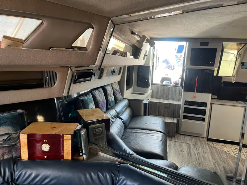 Slide: The Image of Interior of 1987 Sea Ray 460 yacht with leather seating and modern amenities. - 37