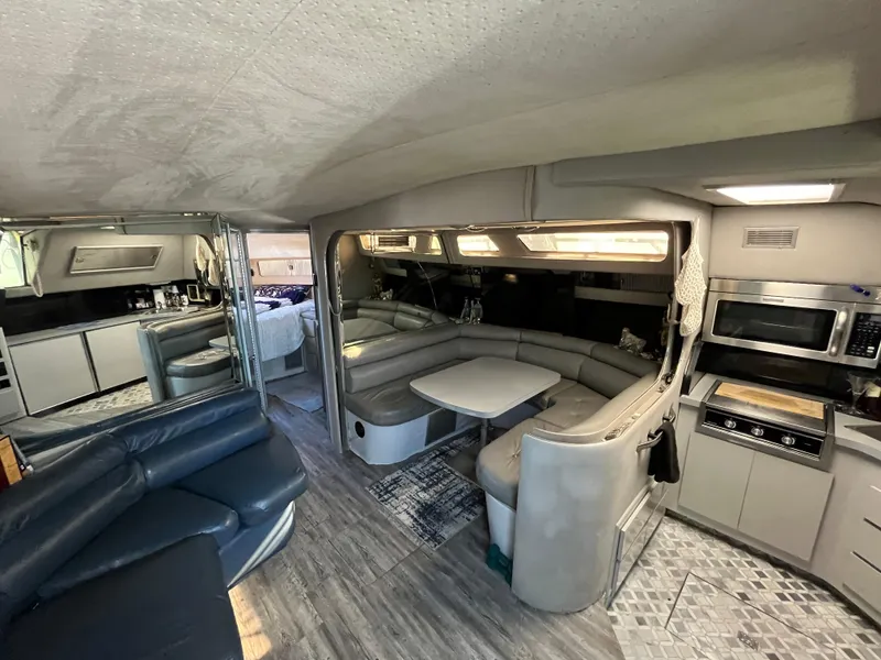 Slide: The Image of Interior of a 1987 Sea Ray 460 yacht with modern kitchen and seating area. - 38