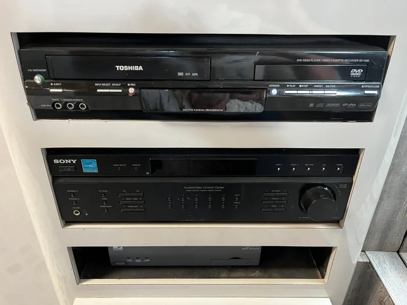 Slide: The Image of Toshiba DVD player and Sony audio receiver in a 1987 Sea Ray 460 yacht. - 39