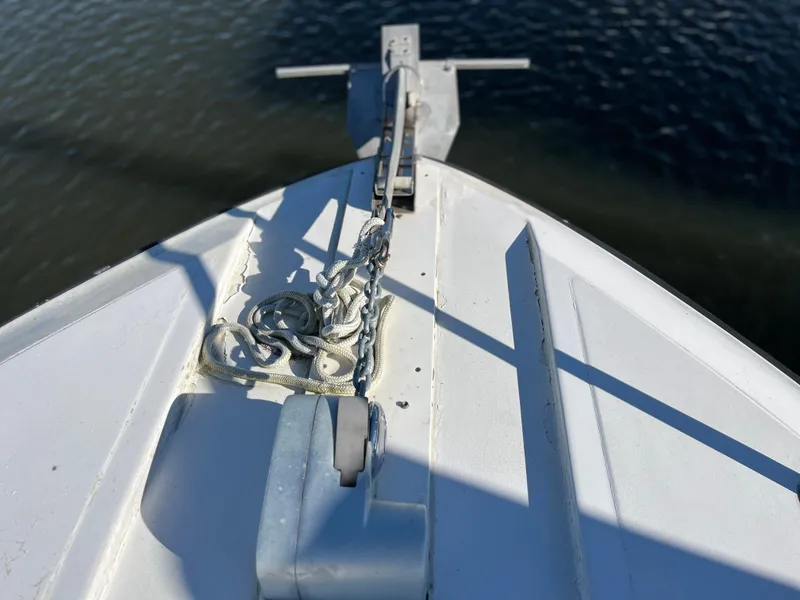 Slide: The Image of Bow of 1987 Sea Ray 460 boat with anchor chain over water. - 8