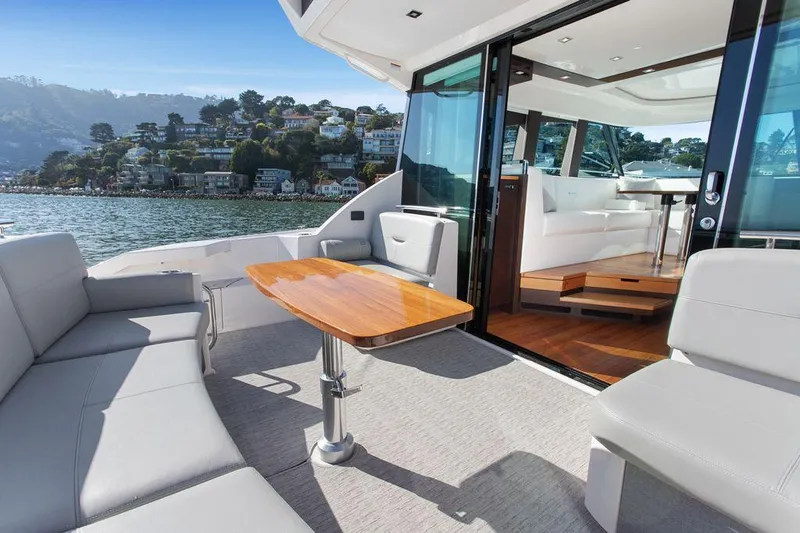 Slide: The Image of 2018 Tiara Yachts C44 Coupe with spacious deck and luxurious interior on scenic waterfront. - 15