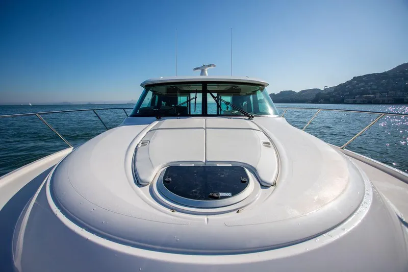 Slide: The Image of 2018 Tiara Yachts C44 Coupe on open water, front deck view. - 21