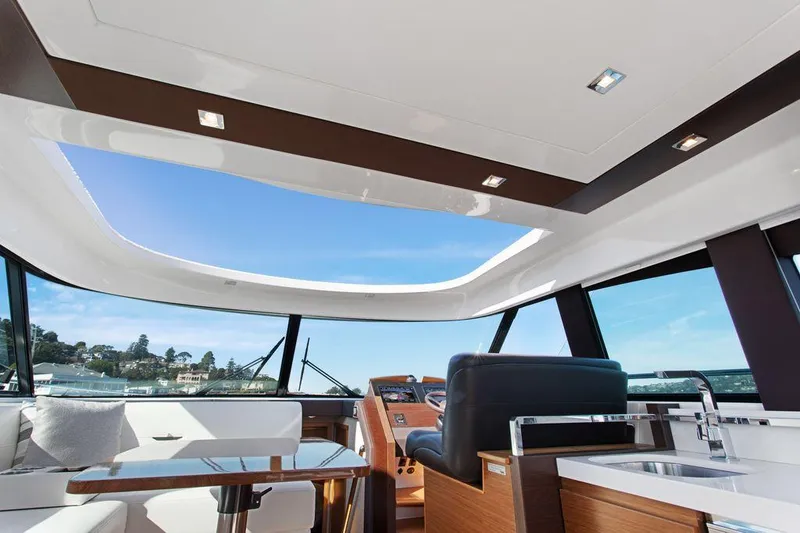 Slide: The Image of Interior of 2018 Tiara Yachts C44 Coupe with panoramic windows and modern design. - 24