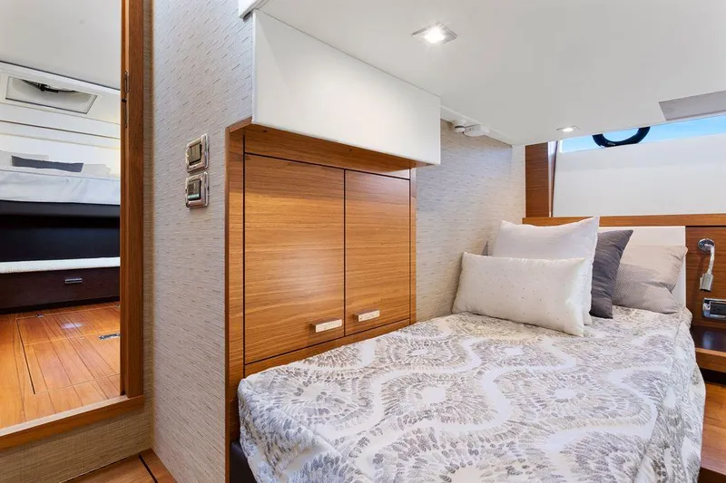 Slide: The Image of Luxurious cabin interior of 2018 Tiara Yachts C44 Coupe with elegant bedding. - 38