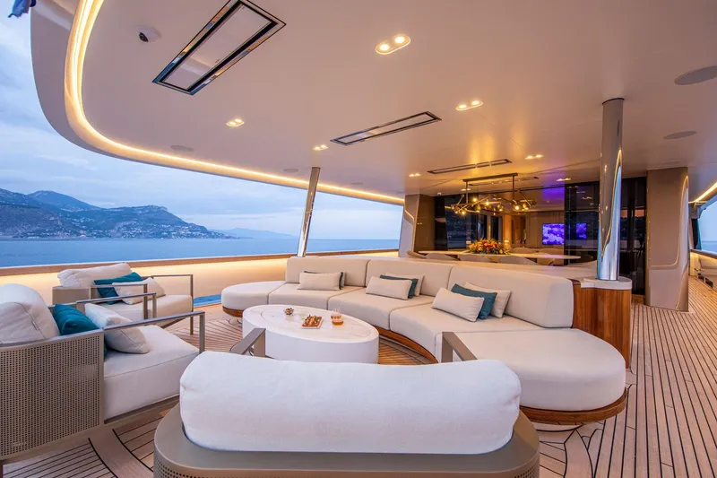 Slide: The Image of Luxurious 2021 Van der Valk Custom 34M Explorer yacht interior with elegant seating and ocean view. - 12