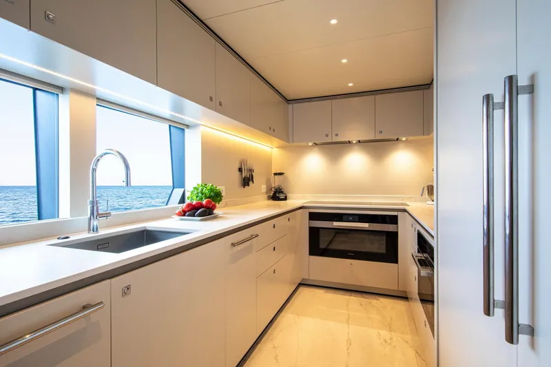 Slide: The Image of Modern kitchen in 2021 Van der Valk Custom 34M Explorer yacht with ocean view. - 16