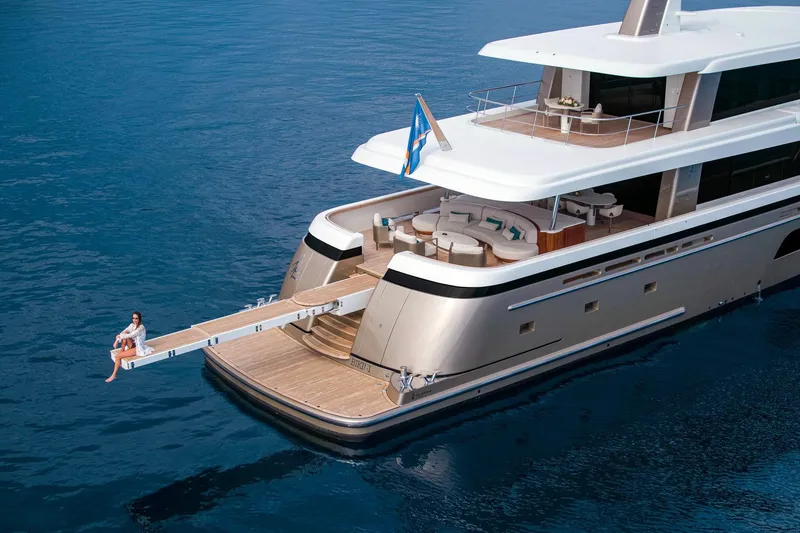 Slide: The Image of Luxury Van der Valk Custom 34M Explorer yacht on serene blue waters, 2021 model. - 4