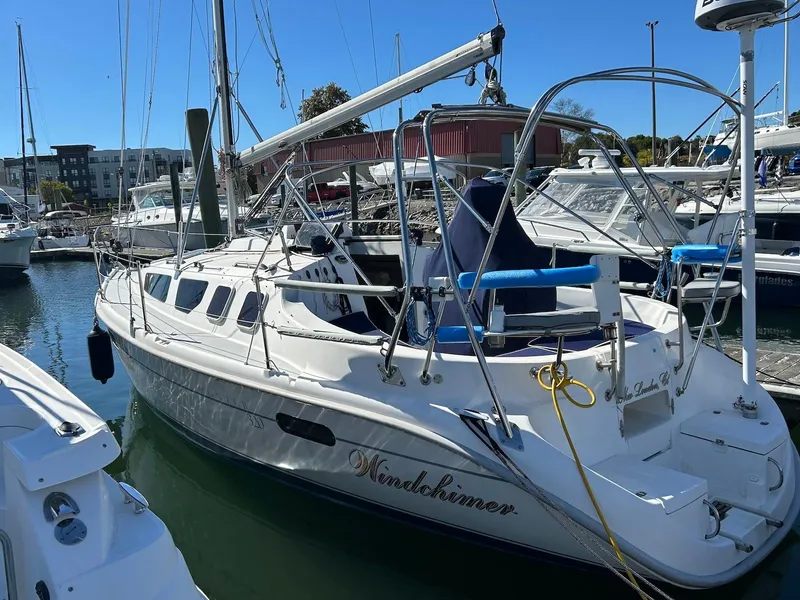 Slide: The Image of 2001 Hunter 320 sailboat docked in marina, sunny day. - 0