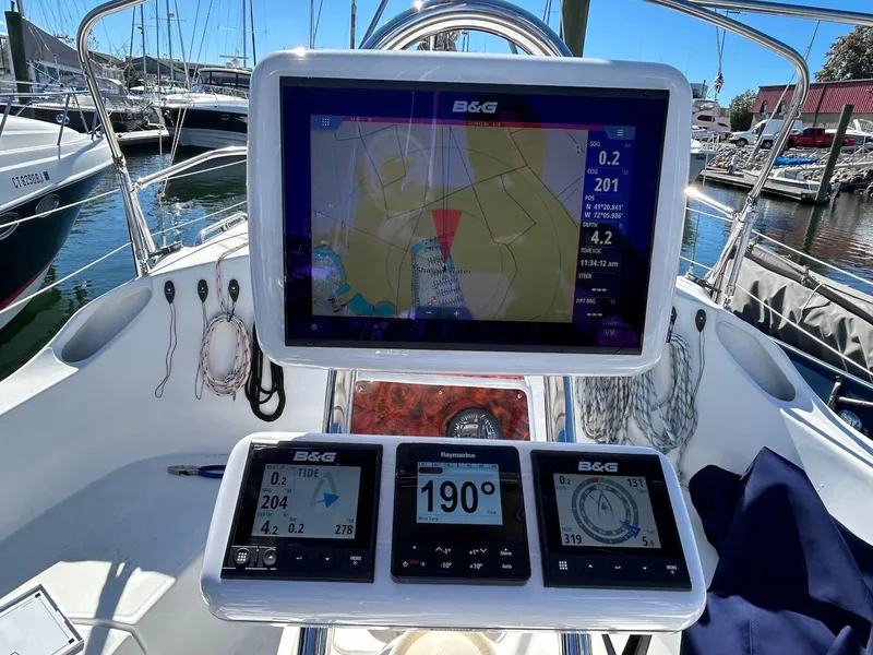 Slide: The Image of Sailboat cockpit with navigation equipment on a 2001 Hunter 320. - 4