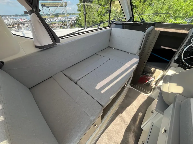 Slide: The Image of Interior of 2025 Bayliner Trophy T29 Explorer with comfortable seating and modern design. - 10