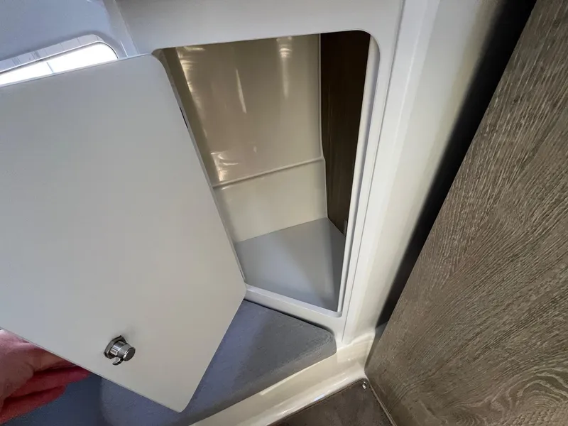 Slide: The Image of Open storage compartment in 2025 Bayliner Trophy T29 Explorer boat interior. - 17