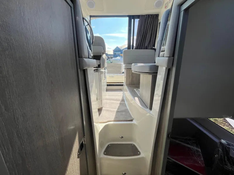 Slide: The Image of Interior view of 2025 Bayliner Trophy T29 Explorer boat, featuring modern seating and design. - 23