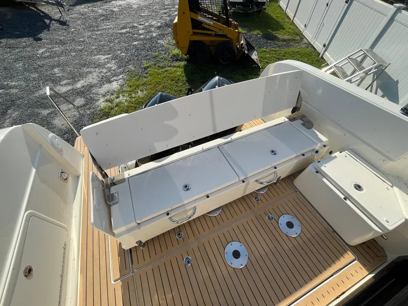 Slide: The Image of 2025 Bayliner Trophy T29 Explorer boat deck with seating and storage compartments. - 6