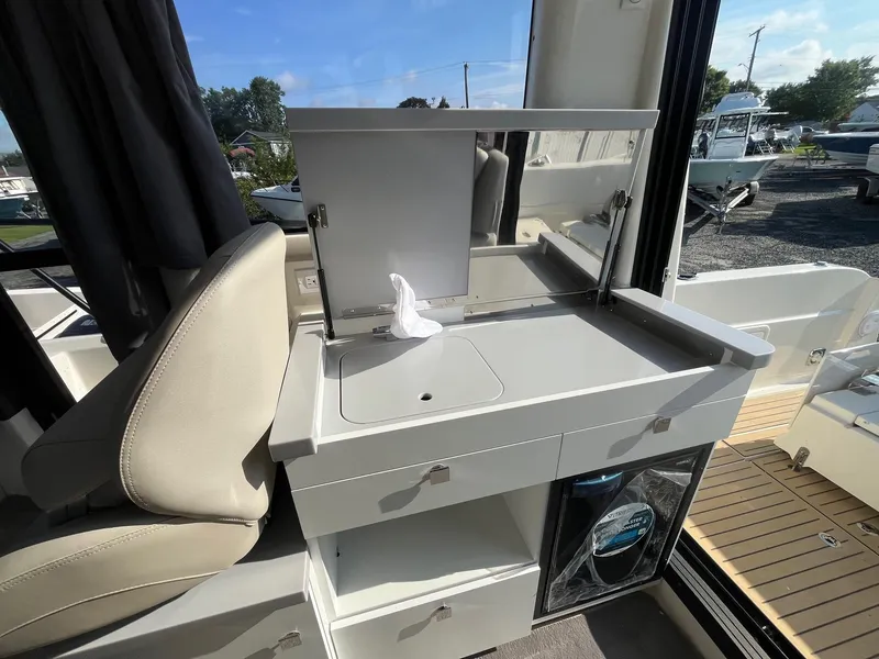 Slide: The Image of Interior of 2025 Bayliner Trophy T29 Explorer with modern sink and storage. - 8