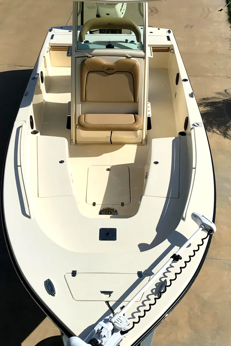 Slide: The Image of 2018 Scout 251 XSS boat, top view, beige interior, sleek design. - 10
