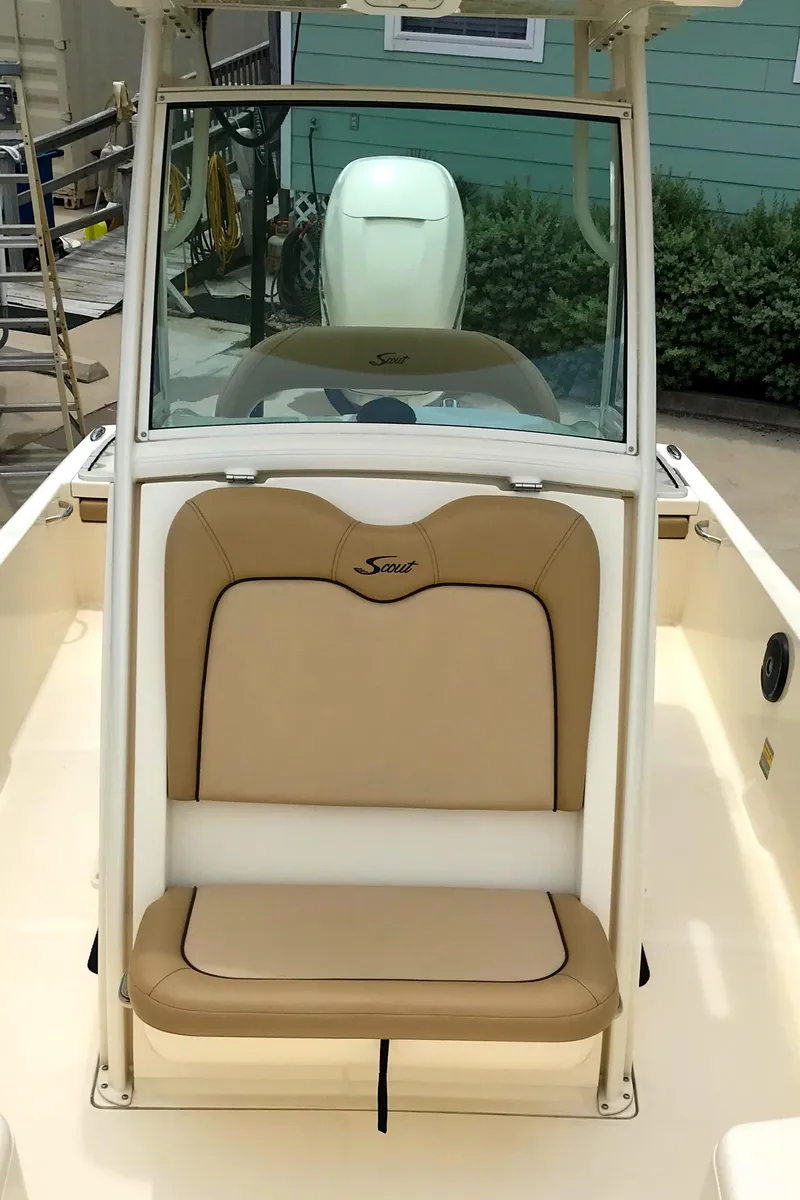 Slide: The Image of 2018 Scout 251 XSS boat with tan seating and console. - 12