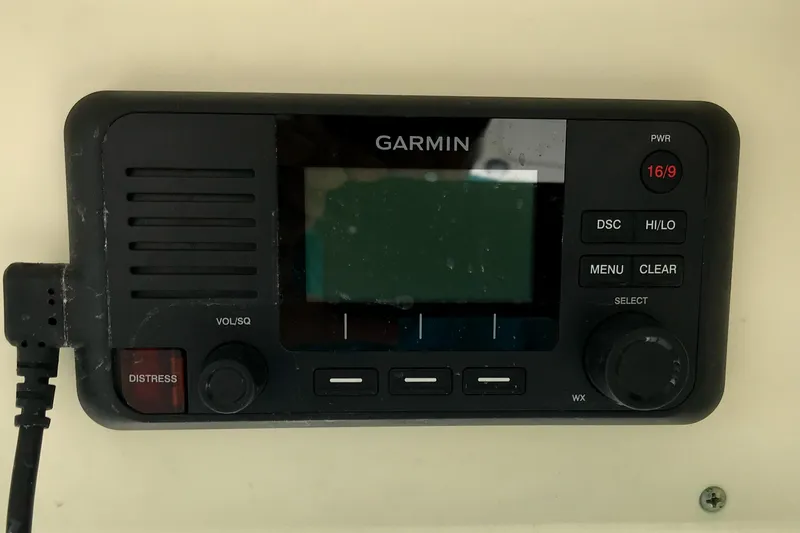 Slide: The Image of Garmin marine radio on 2018 Scout 251 XSS boat dashboard. - 23