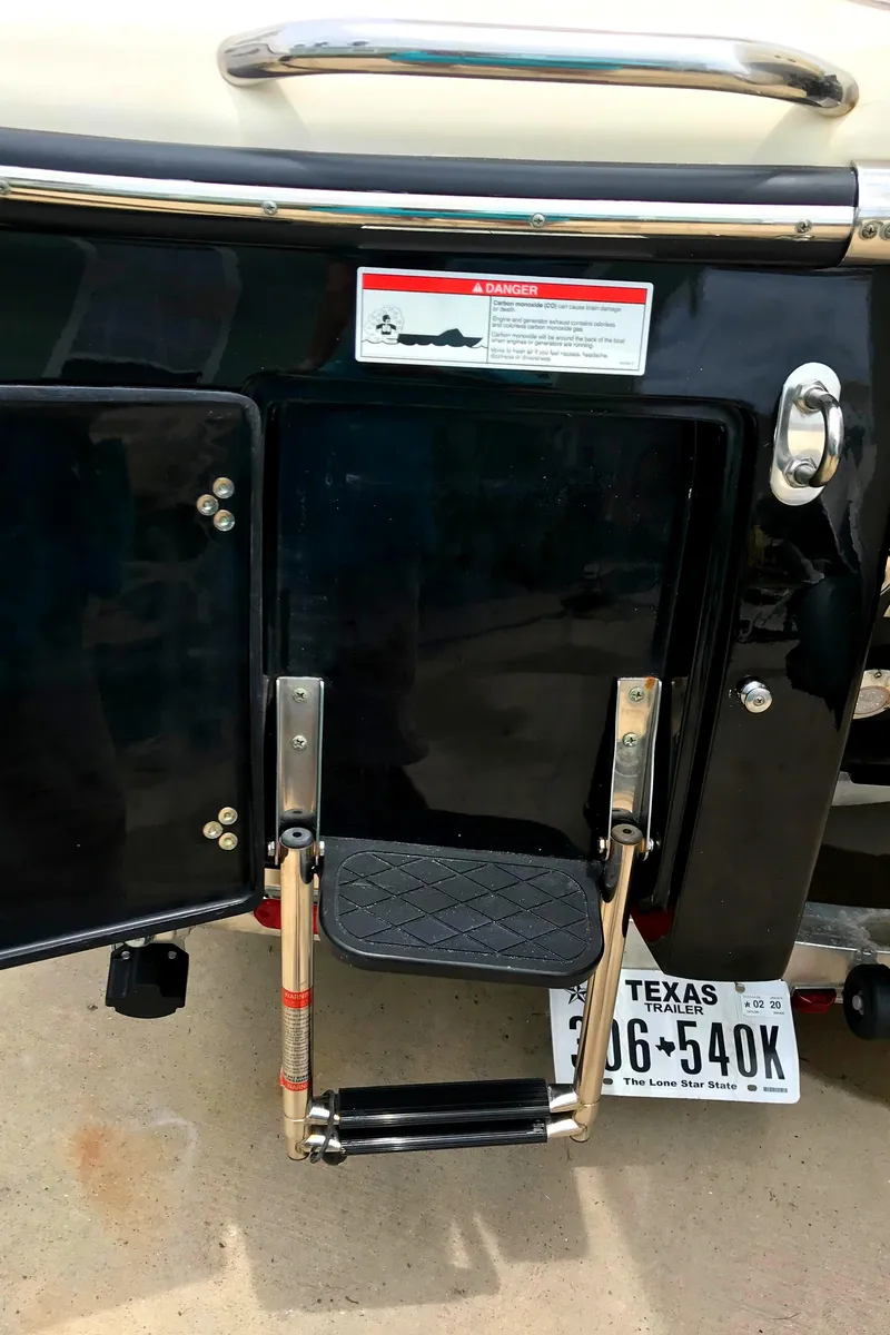 Slide: The Image of 2018 Scout 251 XSS boat ladder with Texas license plate. - 26