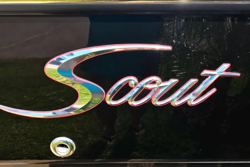 Slide: The Image of Scout 251 XSS 2018 logo on glossy black surface. - 7