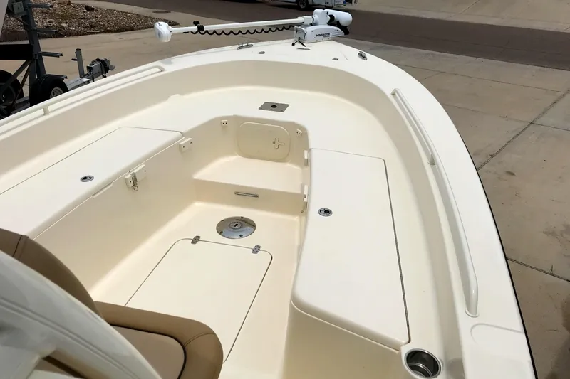 Slide: The Image of 2018 Scout 251 XSS boat interior with seating and storage compartments. - 9