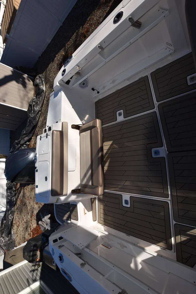 Slide: The Image of 2022 Cutwater C-24 DC boat interior with seating and non-slip flooring. - 14