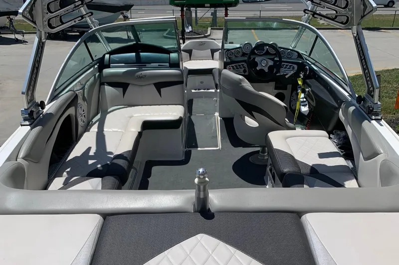 Slide: The Image of 2009 MasterCraft X15 boat interior with seating and dashboard. - 2