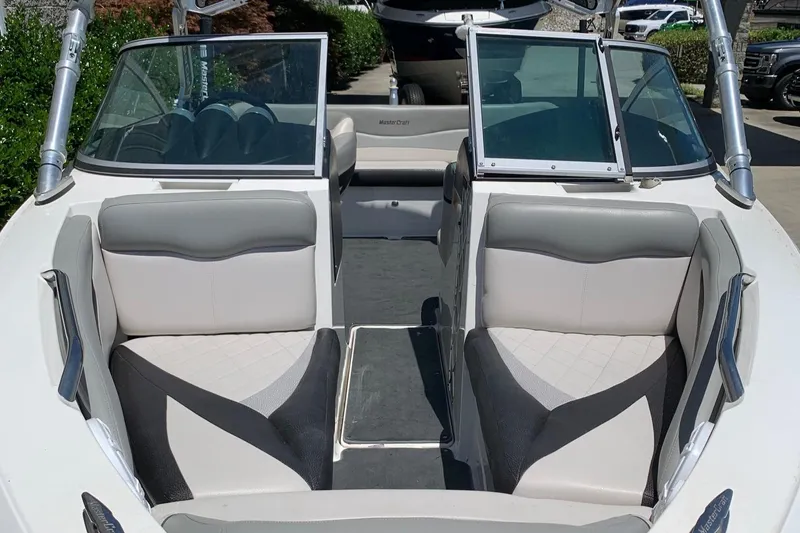 Slide: The Image of 2009 MasterCraft X15 boat interior with gray and white seating. - 3