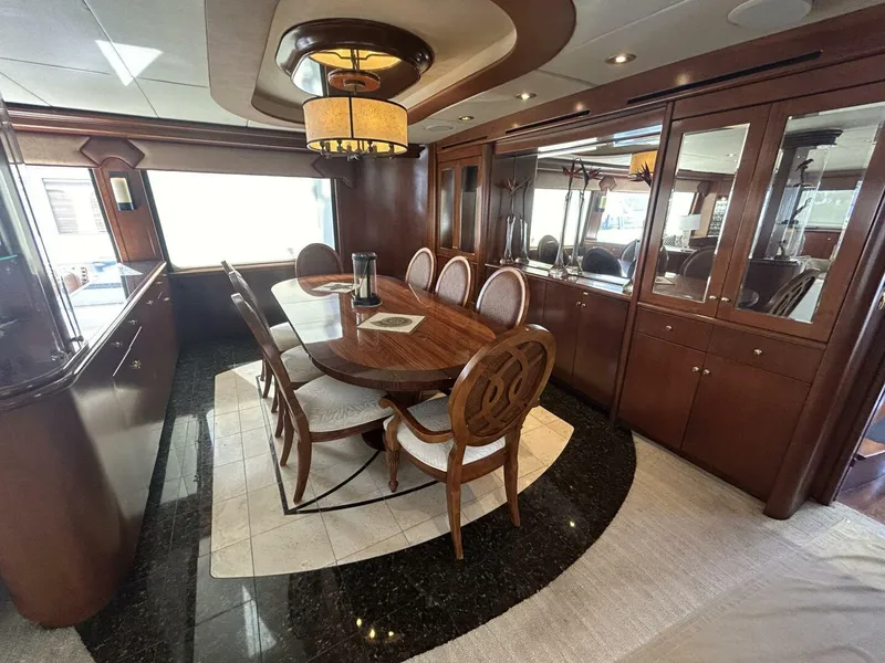 Slide: The Image of Luxurious dining area on a 2001 Dovercraft Custom RPH yacht with elegant wood furnishings. - 14