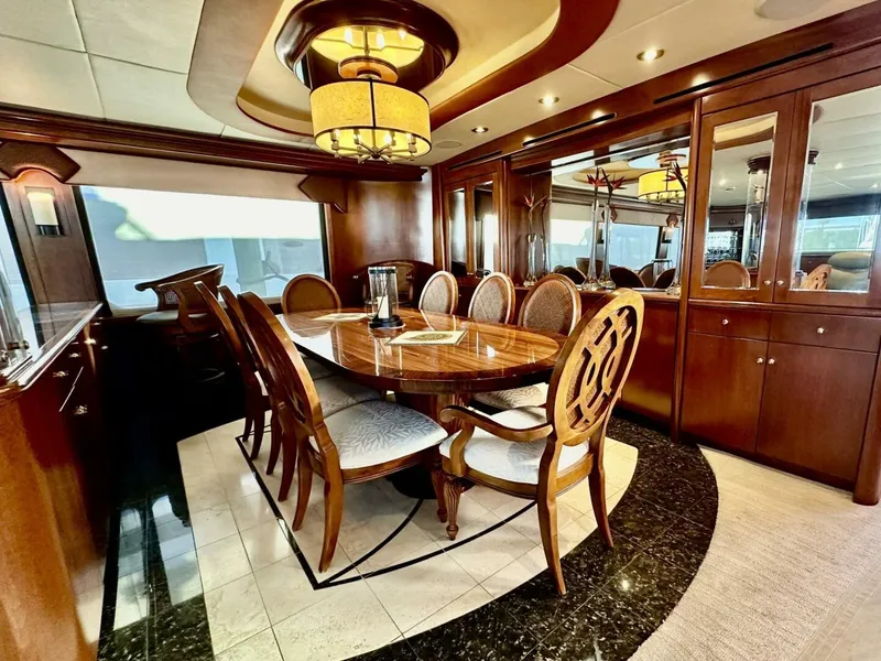 Slide: The Image of Luxurious dining area on 2001 Dovercraft Custom RPH yacht with elegant wood furnishings. - 15