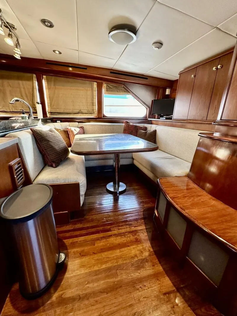 Slide: The Image of Luxurious interior of 2001 Dovercraft Custom RPH yacht with elegant wood finishes and cozy seating. - 18