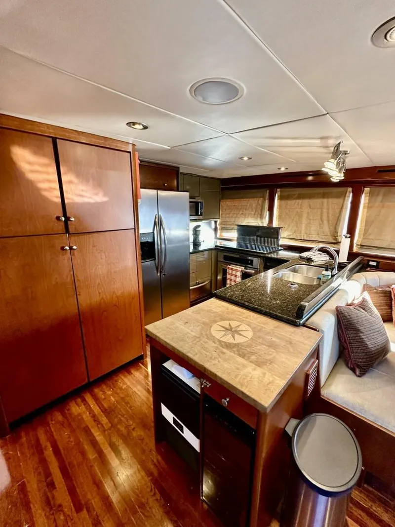 Slide: The Image of Luxurious kitchen interior of 2001 Dovercraft Custom RPH yacht with modern appliances and wood finishes. - 19