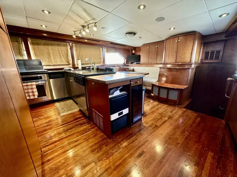 Slide: The Image of Luxurious 2001 Dovercraft Custom RPH yacht interior with modern kitchen and wooden flooring. - 20