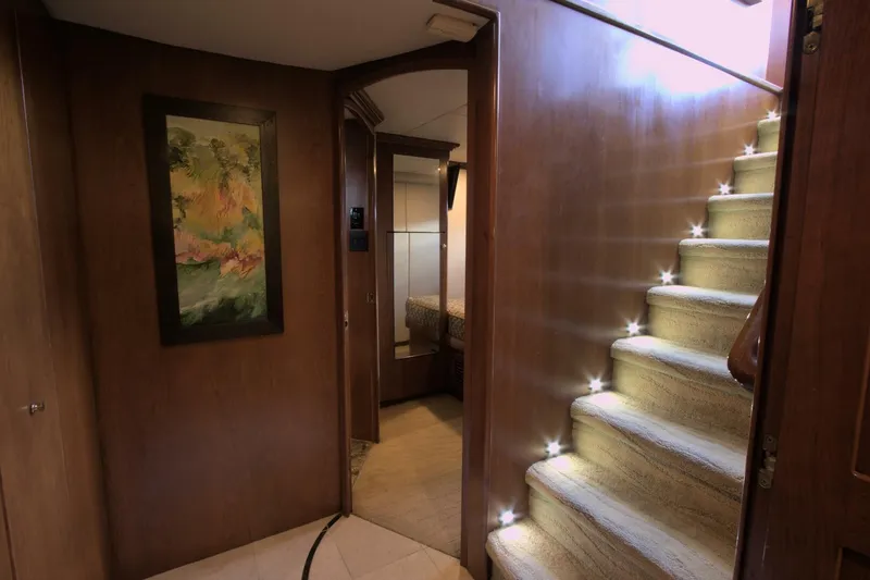 Slide: The Image of Luxurious interior of 2001 Dovercraft Custom RPH yacht with elegant staircase and artwork. - 21