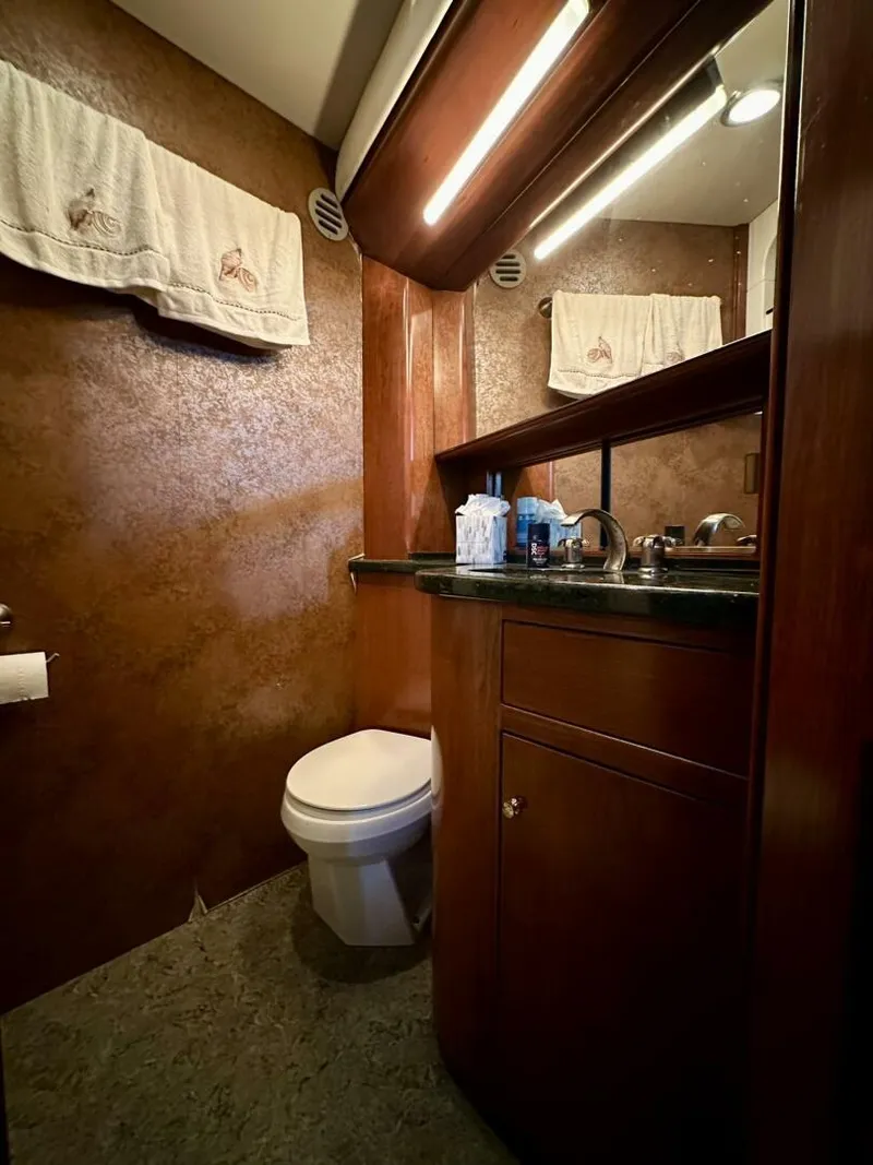 Slide: The Image of Luxurious bathroom in 2001 Dovercraft Custom RPH yacht with wood accents and modern fixtures. - 23