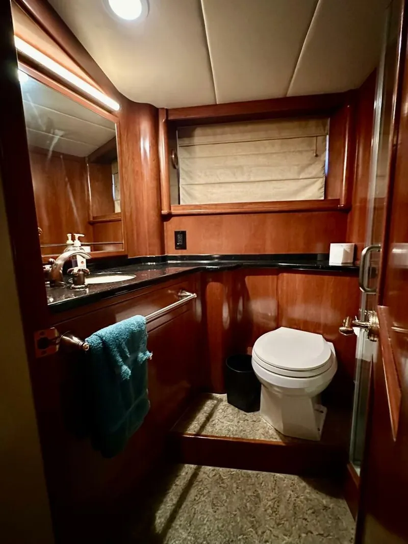 Slide: The Image of Luxurious bathroom in 2001 Dovercraft Custom RPH yacht with wood paneling and modern fixtures. - 25