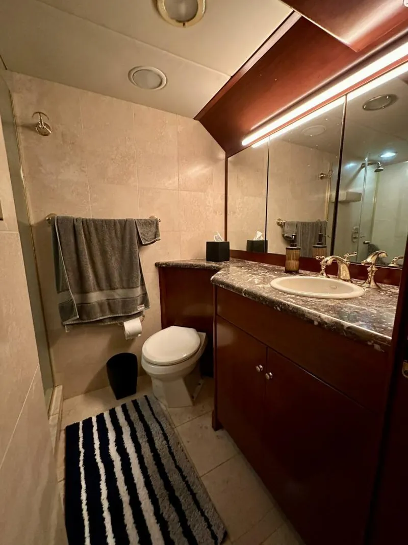 Slide: The Image of Luxurious bathroom in a 2001 Dovercraft Custom RPH yacht with elegant fixtures and modern design. - 26