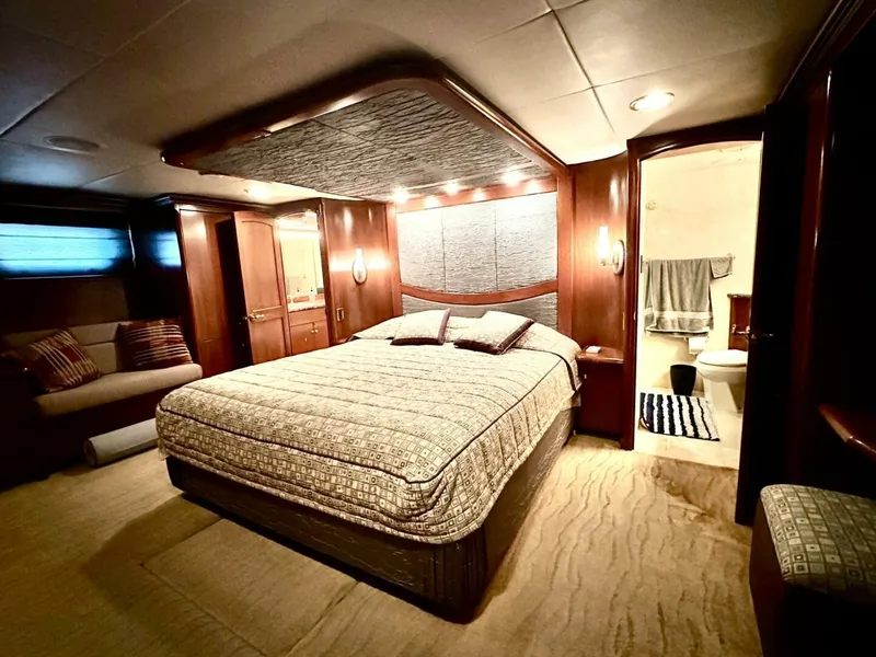 Slide: The Image of Luxurious bedroom interior of 2001 Dovercraft Custom RPH yacht with elegant wood finishes. - 27